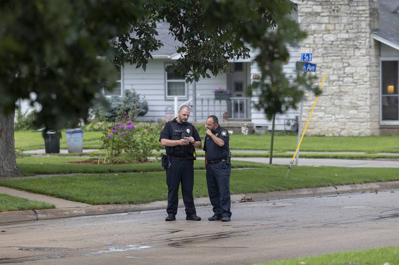 Sterling officer Lucas Nease speaks with chief Alex Chavira Tuesday, July 23, 2024 at the scene of a shooting.
