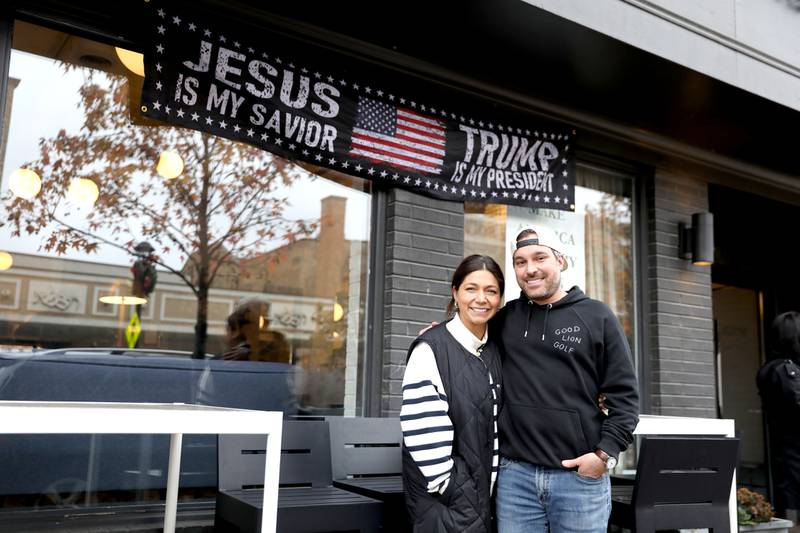 Ashley and Matt Marquez. owners of Moveable Feast and Company in Wheaton, displayed a banner in support of President-elect Donald Trump following the election on November 5, 2024. The company was included in a list of pro-Trump businesses posted on a private Facebook page, Fox Valley Activists. Second Ward Alderperson Martha Paschke, who was an administrator for the site, has been targeted with criticism and threats as a result.