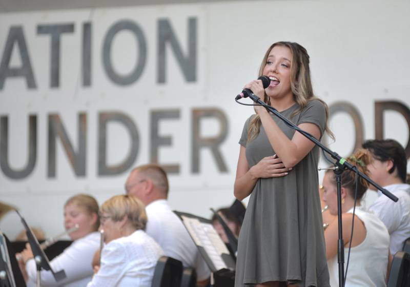 Bailee Fyock of Forreston sang two solos at the Kable Concert Band on Wednesday, July 23, 2025 in Mt. Morris. Travis Cunningham, he music/band teacher for Forreston High School and Junior High, was the guest conductor for evening concert. Fyock sang For Good from Wicked and Let it Go from Frozen.