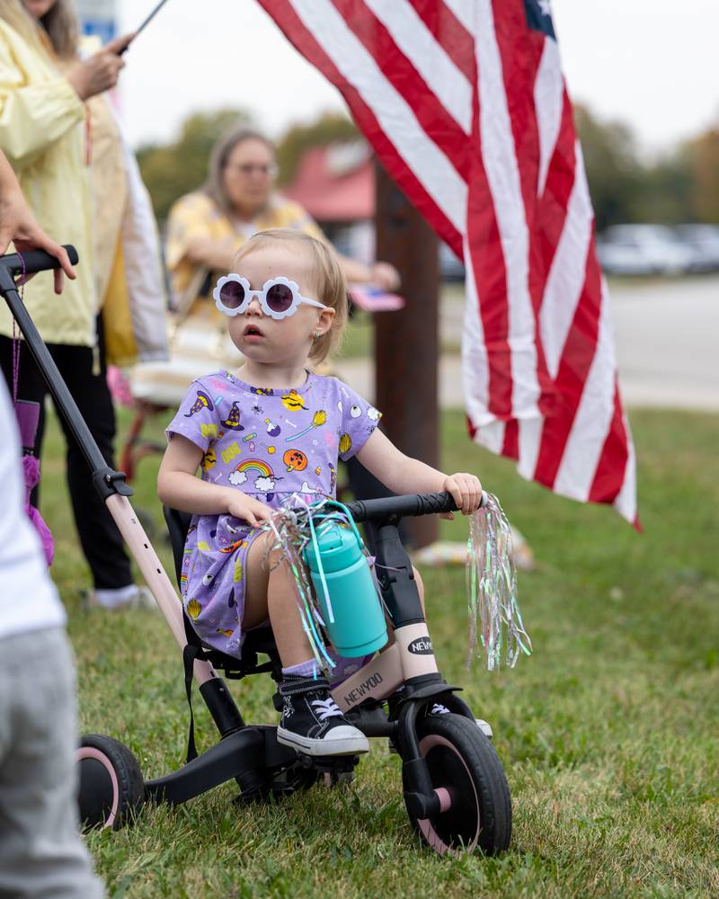 Child rides tricycle at the ‘No Kings 2.0’ Protest on Saturday, October 18, 2025 on North Division Street in Morris.