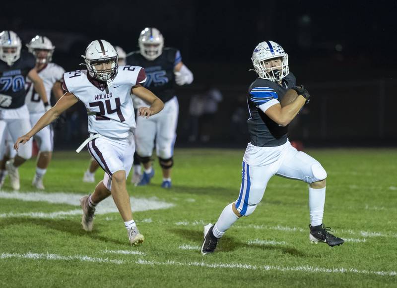 Burlington Central's Christian Livingston runs with the ball as Prairie Ridge's Vincent Byk during their game on Friday, September 19, 2025 at Burlington Central High School. Ryan Rayburn for Shaw Local