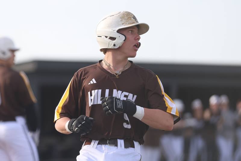 Joliet Catholic’s Cody Busch scores on a Brady Tunnel hit against Lincoln-Way Central on Wednesday, March 25, 2026 in New Lenox.