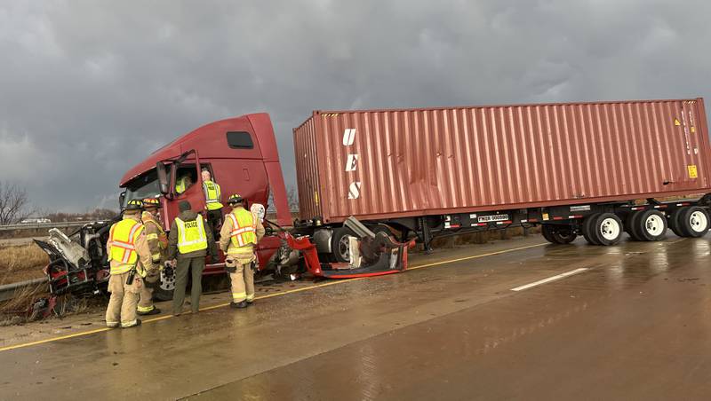 Princeton firefighters work the scene of a semi crash on Interstate 80 on top the Illinois Route 34 overpass on Monday, March 19, 2025 in Princeton. The accident happened  in the eastbound lane of Interstate 80 shortly after 5p.m. Illinois State Police also responded to the incident. Traffic was down to one-lane for about an hour.