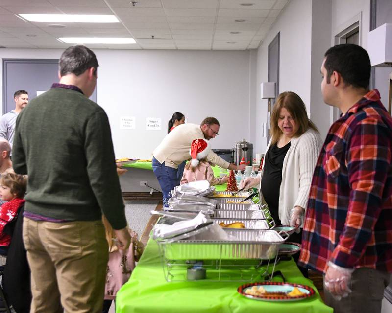 Attendees get some breakfast during the breakfast with Santa event held on Sunday Dec. 15, 2024, held at the La Grange Park District Recreation Center.
