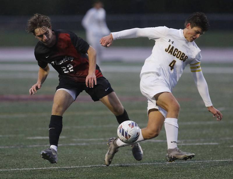 Huntley's Tyler Murray fouls Jacobs' Andrew Deegan going for there ball during an IHSA Class 3A Huntley Regional boys soccer semifinal match on Tuesday, Oct. 21, 2025, at Huntley High School.