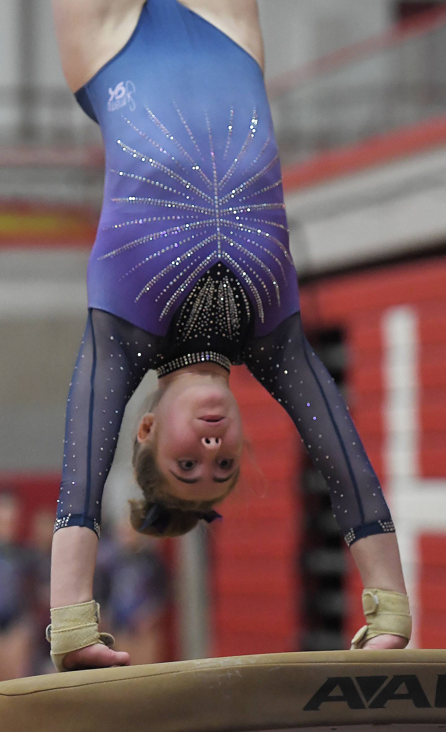 Downers Grove South's Edith Condon on the vault at the Hinsdale Central girls gymnastics sectional meet in Hinsdale on Monday, Feb. 5, 2024.