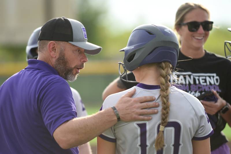 Manteno softball coach Josh Carlile, left, talks to Alyssa Singleton during a break in the Panthers' game at Coal City Monday, May 12, 2025.