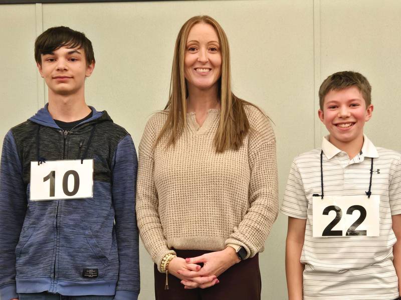 Mason Coulthard (left) was named the winner of the Carroll, Jo Daviess, Stephenson Regional Spelling Bee. He is pictured with Sarah Meador of the Regional Office of Education and 
Hendrix Feld, who placed second at the spelling bee.