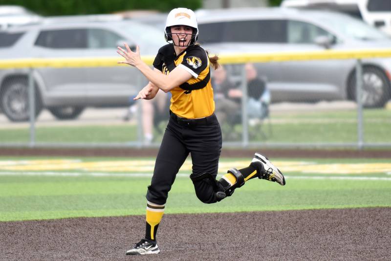 Herscher's Keira Ahramovich joyously rounds the bases following her go-ahead home run in the sixth inning of a Class 2A Manteno Regional quarterfinal game against Peotone at Herscher Monday, May 18, 2026.