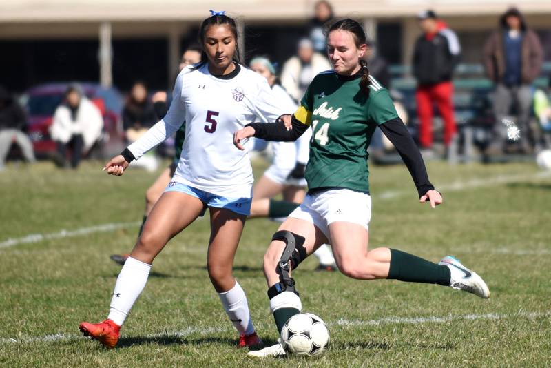 Bishop McNamara's Ella Langellier, right, makes a pass as Kankakee's Elizabeth Avalos defends during an All-City game Saturday, March 22, 2025.