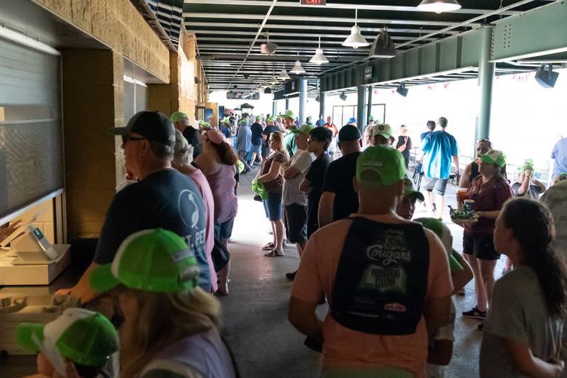 Sean King for the Daily Herald
Kane County Cougars fans wait in line for concessions on opening day at Northwestern Medicine Field in Geneva on Friday, May 13, 2022.