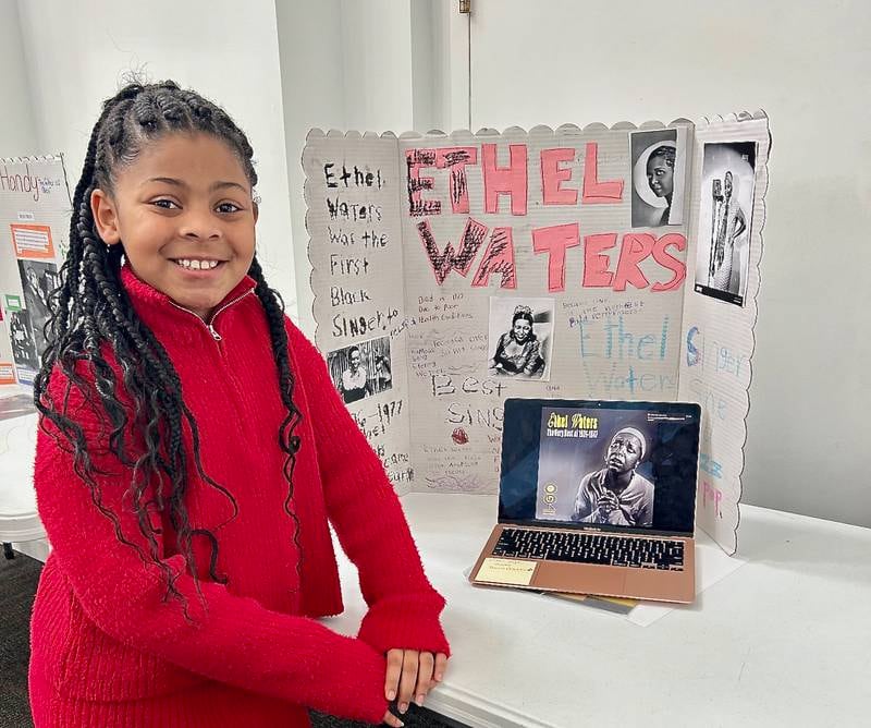 Harmoni Threadgill poses with her work on singer and actress Ethel Waters on Sunday, Feb. 16, 2025, at New Hope Missionary Baptist Church in DeKalb. Threadgill's presentation was part of the church's annual Black History Month event "Displays of Excellence."
