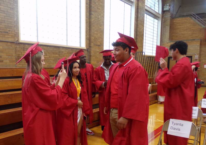 Streator High School graduating seniors take pictures prior to the graduation ceremony Sunday, May 21, 2023.