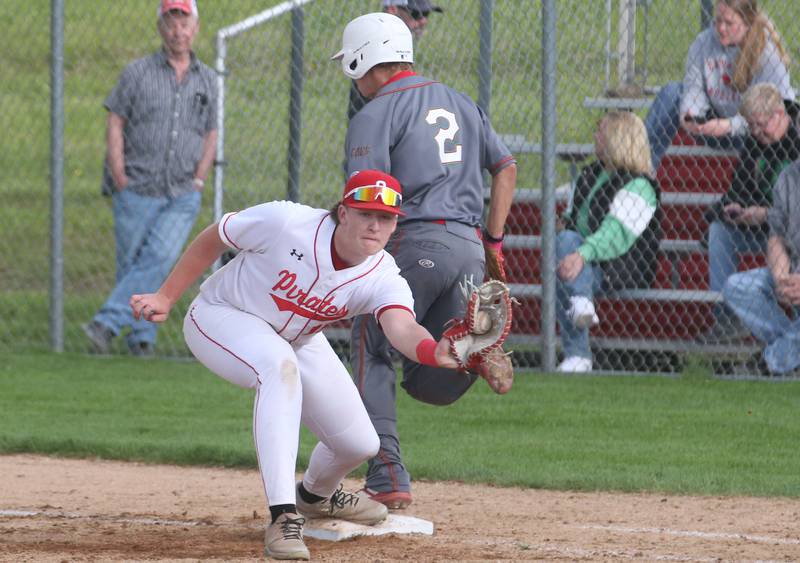 L-P's Gavin Kallis is safe at first base as Ottawa first baseman Brendyn Fuchs catches the ball on Friday, May 2, 2025 at Ottawa High School.