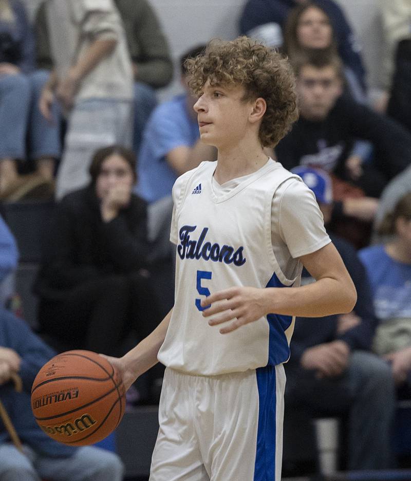 Faith Christian’s Jaxen Coester sets up a play against QC Christian Tuesday, Dec. 9, 2025.