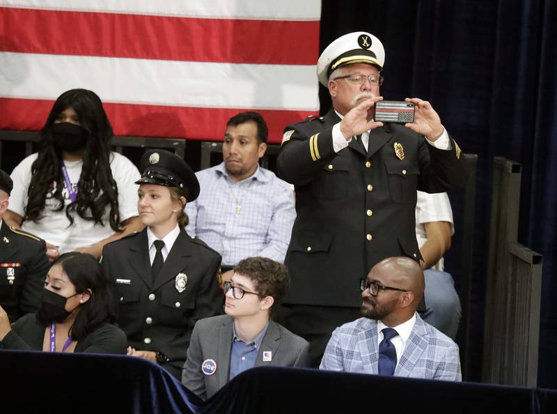 Wes Crain, an instructor and fire science program chair at McHenry County College, takes a picture before President Joe Biden, speaks Wednesday, July 7, 2021, at McHenry County College in Crystal Lake.