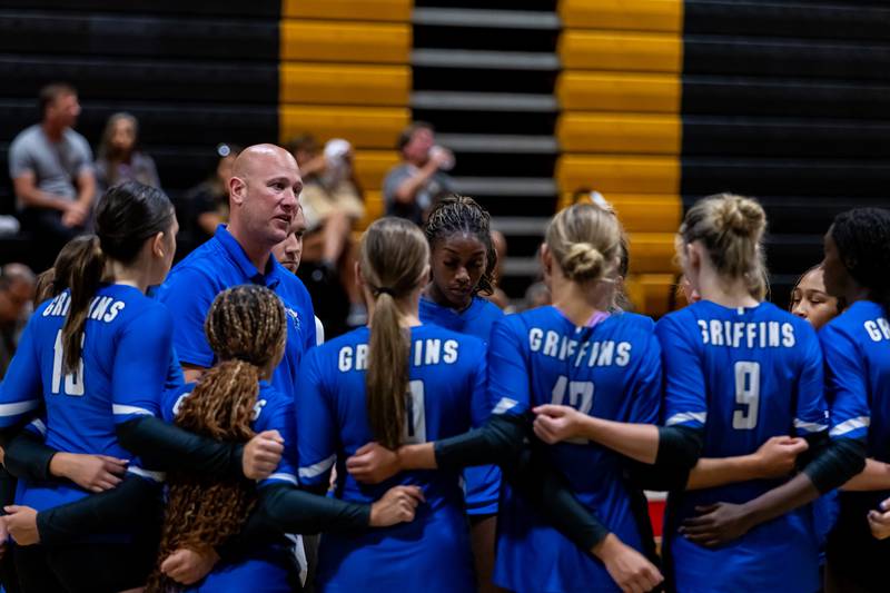 Lincoln-Way East Coach Sean Burns talks to the team between sets against Joliet West during a Varsity Volleyball match at Joliet West on Aug. 26, 2025.