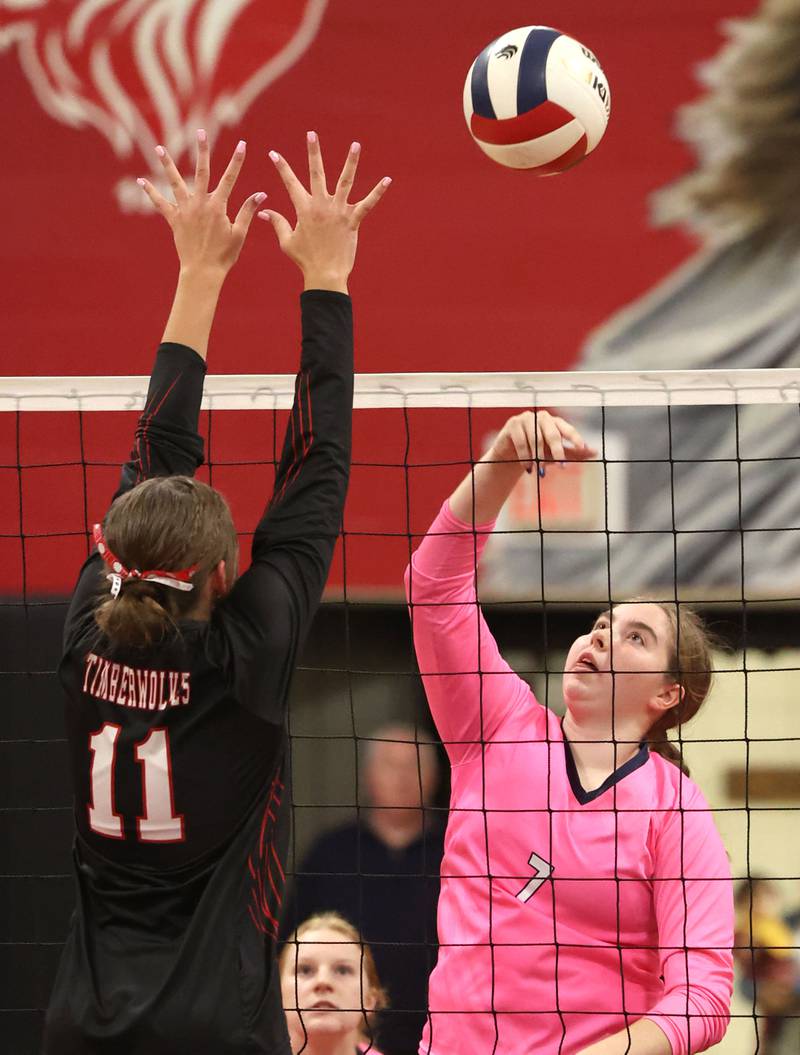 Hiawatha's Brielle Molloy tries to tip the ball over Indian Creek's Ellie Bend during their match Tuesday, Oct. 15, 2024, at Indian Creek High School in Shabbona.