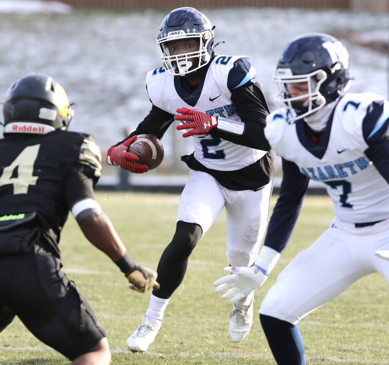 Nazareth's Justin Taylor looks to get by Sycamore's Tyler Curtis Saturday, Nov. 18, 2022, during the state semifinal game at Sycamore High School.