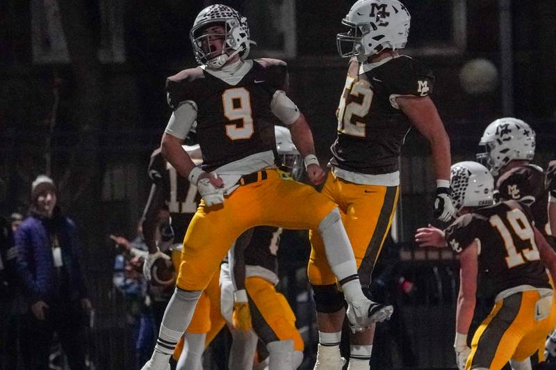 Mt. Carmel's Jack Elliott (9) celebrates after scoring a touchdown against Batavia during a class 7A semifinal football playoff game at Mt. Carmel High School in Chicago on Saturday, Nov 18, 2023.