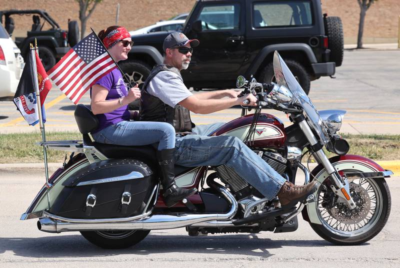 Patriotic motorcycle riders head east on Elm Street Monday, May 29, 2023, during the Sycamore Memorial Day parade.