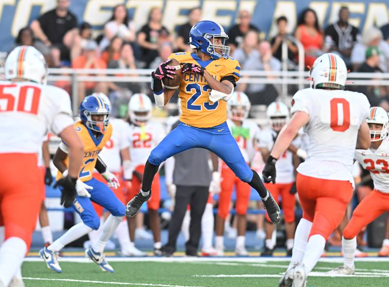 Joliet Central's Dimarius Matthews (23) leaps for a catch during the conference game against Plainfield East on Friday, SEP. 12, 2025, at Joliet.