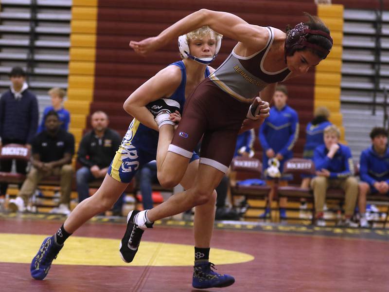 Johnsburg's Eric Bush tries to take down Richmond-Burton's Kristian Gersch during the 113-pound match of a Kishwaukee River Conference wrestling match on Thursday, Jan. 25, 2024, at Richmond-Burton High School.