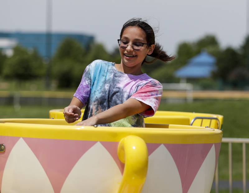 Kamila Ceballos of Crest Hill rides the teacups during the Spring Fling in Westmont, Ill. on Sunday, May 29, 2022.