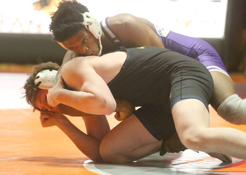 Plano's Prince Amakiri wrestles Yorkvile Christian's Jackson Allen in the 190weight class during the Class 2A Sectional championship on Saturday, Feb. 15, 2025 at Washington High School.