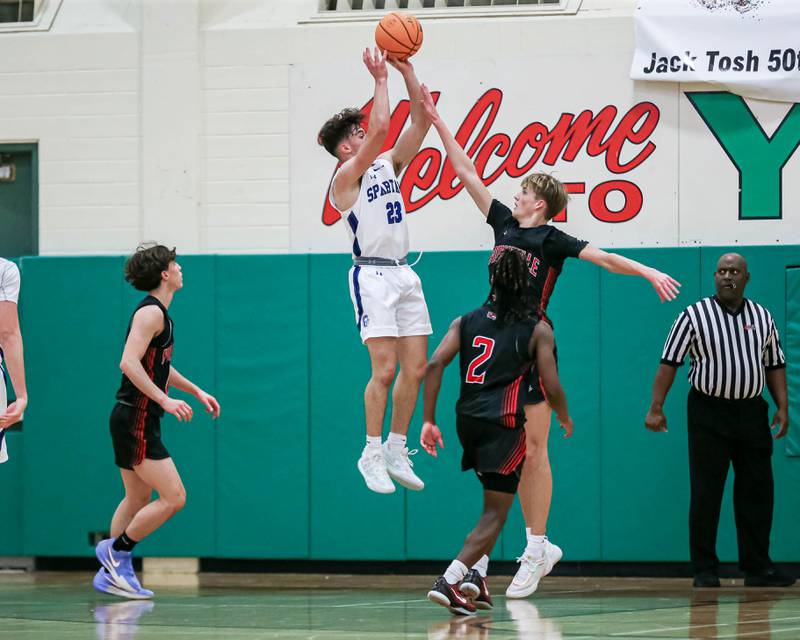 St Francis Mark Balaskovits (23) shoots over Yorkville's Joey Jakstys (32) during their Jack Tosh Holiday Classic basketball tournament game between St Francis at Yorkville Thursday Dec 26, 2024 in Elmhurst.