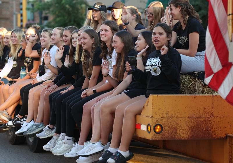 Members of the tennis team make their way down State Street in Sycamore Wednesday, Sept. 25, 2024, during the Sycamore High School homecoming parade.