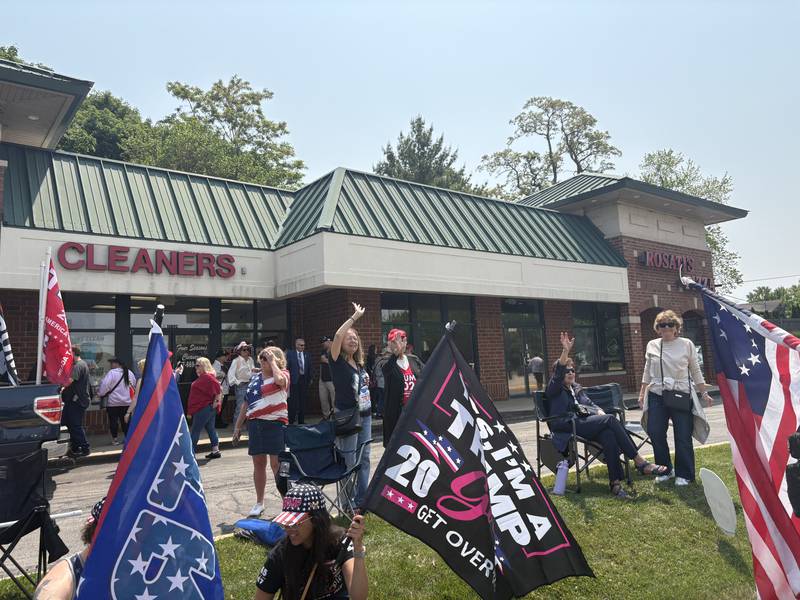 People rally outside the Trump and Truth Store in Huntley May 31, 2025.