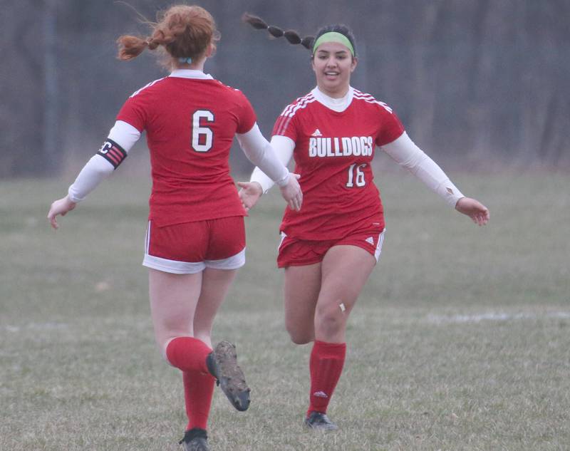 Streator's Ellie Isermann hi-fives teammate Zulima Gunzalez after Gunzalez scored the teams second goal against L-P on Friday, March 24, 2023 in Streator.