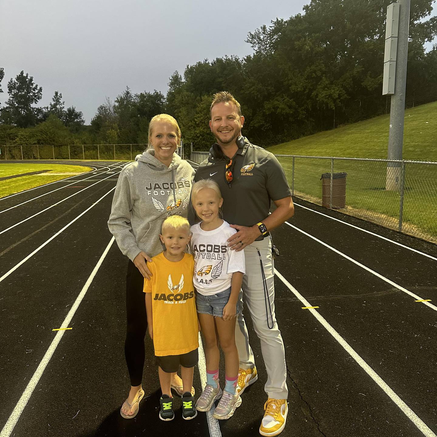 Jacobs football coach Brian Zimmerman and his family, from left: Brynn, Maddox and Macy.