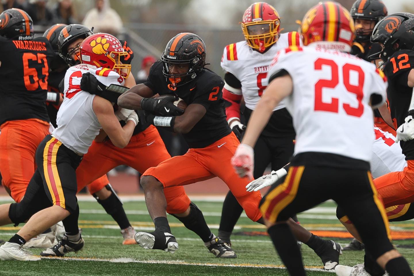 Lincoln-Way West’s Jahan Abubakar secures the ball on a run up the middle against Batavia on Saturday, Nov. 9, 2024 in New Lenox.