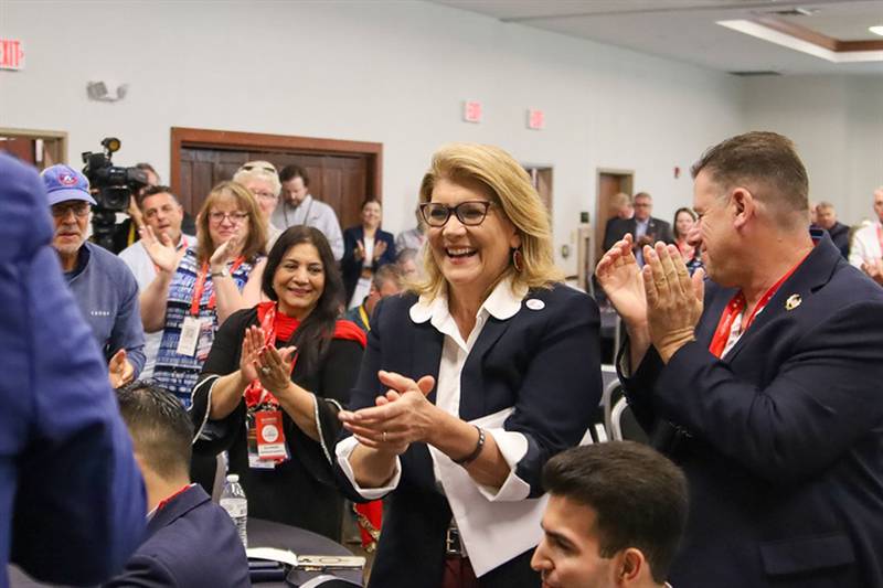 Incoming Illinois Republican Party Chair Kathy Salvi receives applause on Wednesday during the Illinois delegation’s breakfast prior to Republican National Convention programming in Milwaukee.