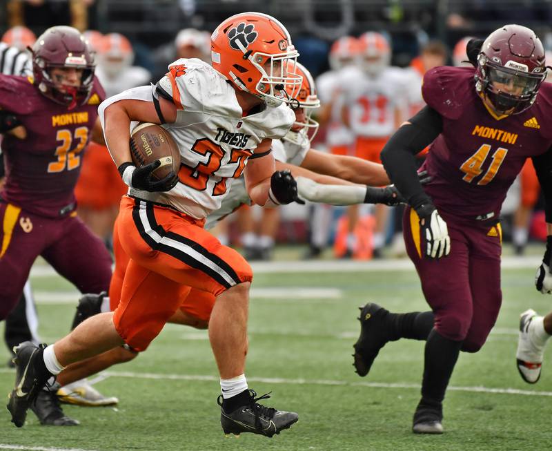 Byron's Caden Considine tries to get past Montini's Jaxon Lane (41) during a Class 3A second-round game on November 9, 2024 at Montini Catholic High School in Lombard.