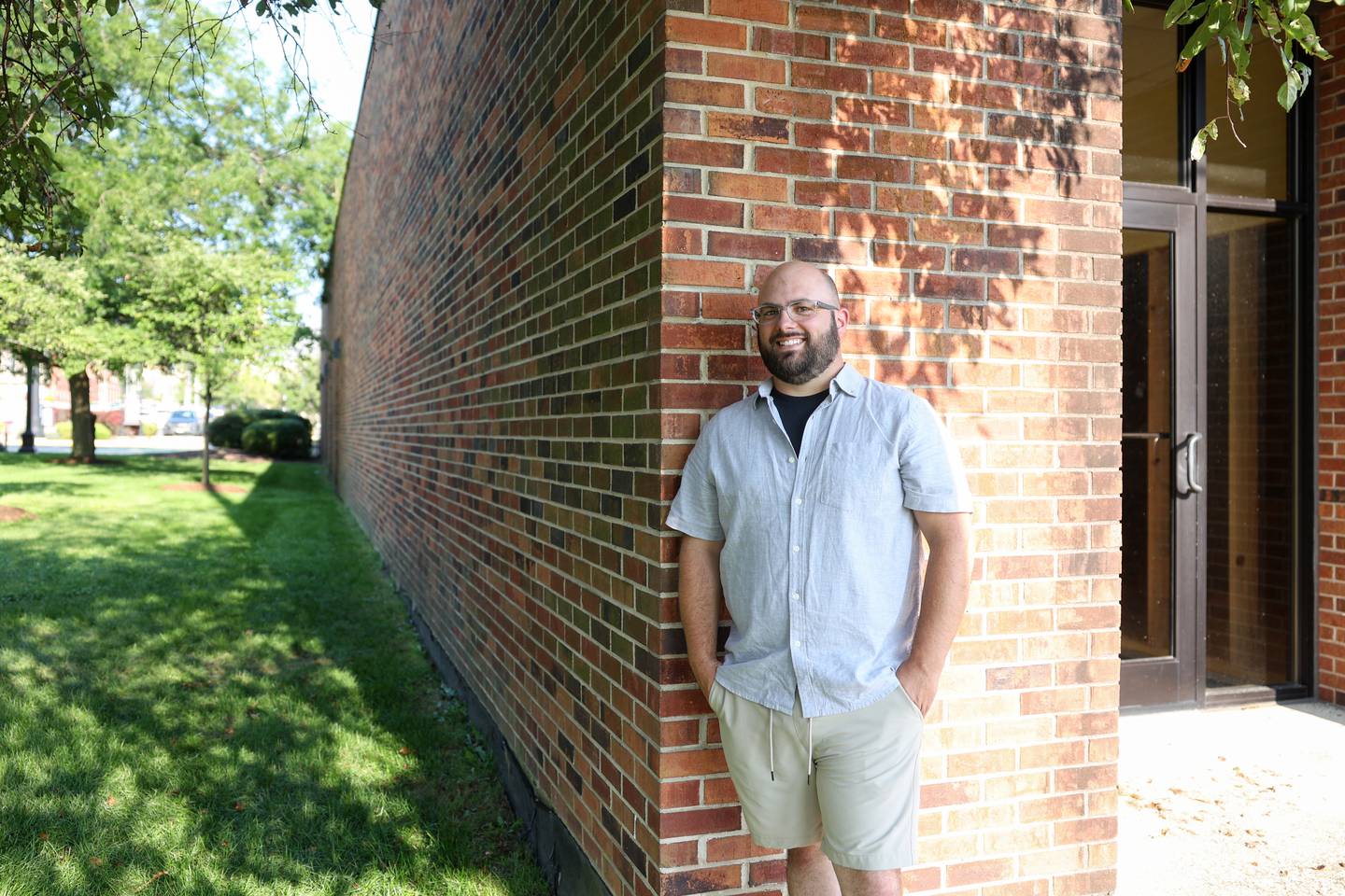 New York City Deli owner Stephen Girard, of Chebanse, stands outside entrance to the deli's future second location in the 200 block of South Schuyler Avenue in the Standard Title building. A patio will be built in the grassy lot just north of the building, with the deli entrance, at right, on the west side facing the Kankakee Train Depot.