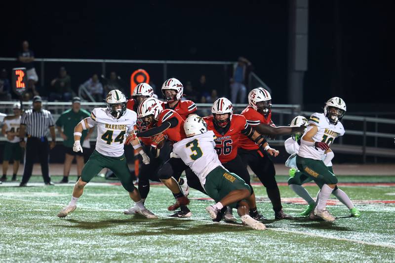 Bradley-Bourbonnais' Isaac Allison runs the all as teammate Joel Morrical (56) trails during the Boilermakers' 35-6 victory over Waubonsie Valley Friday, Sept. 12, 2025.