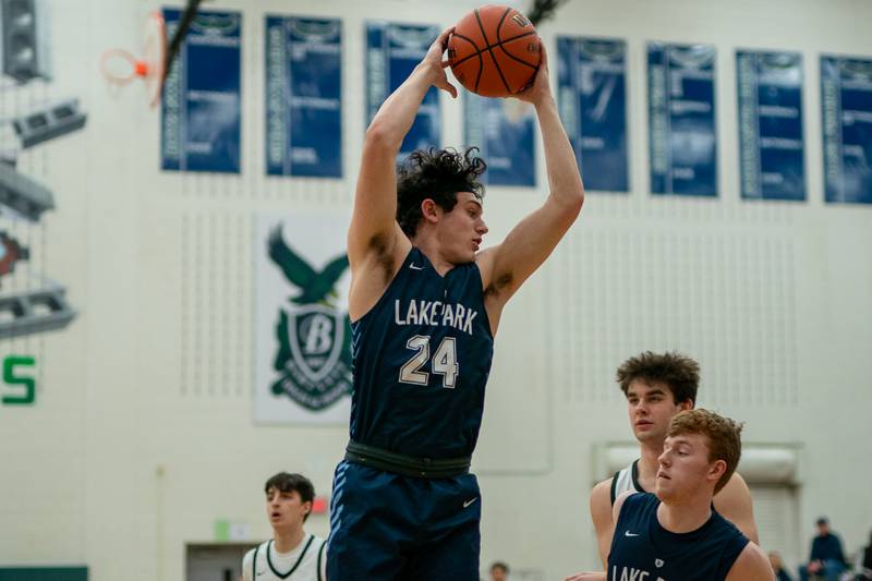 Lake Park's Dennasio LaGioia (24) rebounds the ball against Benet during a Bartlett 4A Sectional semifinal boys basketball game at Bartlett High School on Tuesday, Feb 28, 2023.