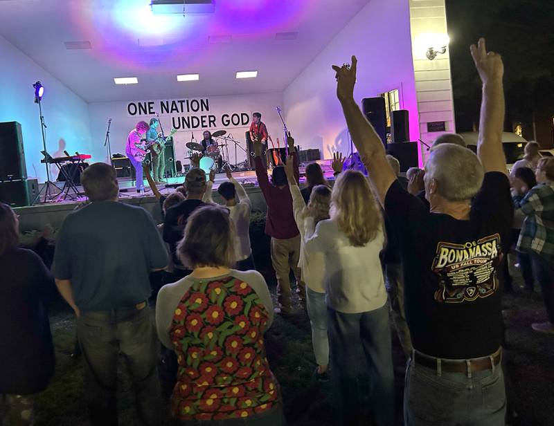 Fans dance and cheer as they listen to  Fortunate Sons, a Creedence Clearwater tribute band, during the Jamboree Concert Series in Mt. Morris on Friday, Aug, 29, 2025.