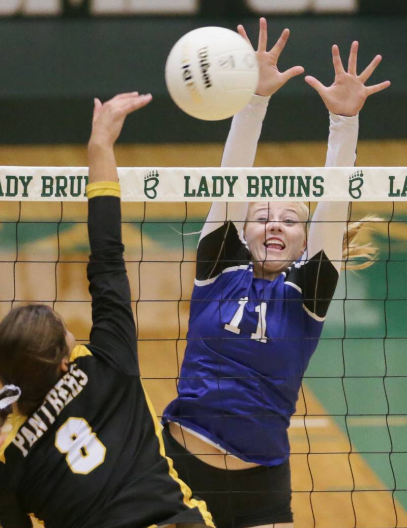 Putnam County's Ava Hatton (8) pushes the ball past Newark's Bre Dixon (11) in the Class 1A semifinal game on Wednesday, Oct. 16, 2022 at St. Bede Academy in Peru.