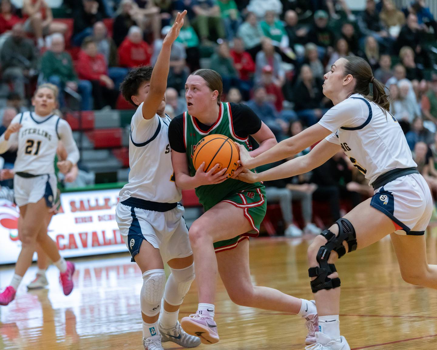 Alexus Hines of LP battles through Sterling defense to grab the layup during the IHSA Class 3A Girls Basketball Regionals in Sellett Gym on February 16, 2026 at LaSalle-Peru High School.