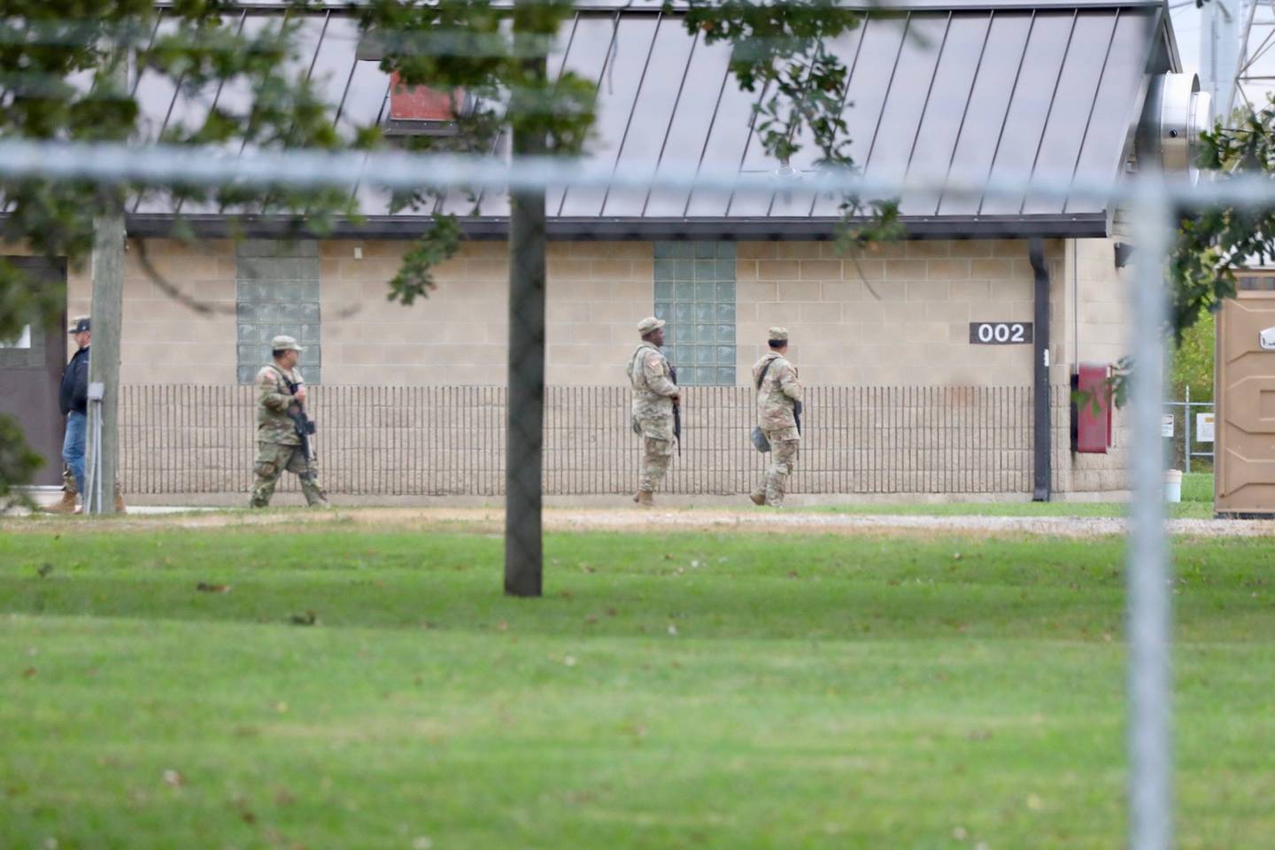 Soldiers walk the grounds of the  Joliet Local Training Area site for the Illinois National Guard at 20612 Arsenal Road in Elwood on Tuesday, Oct. 7, 2025.