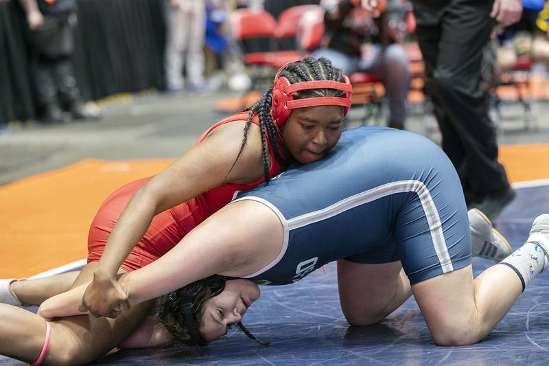 Ini Odumosu of Homewood-Flossmor works on Jayden Huesca-Rodriguez in the 190 pound championship match at the IHSA girls state wrestling championship Saturday, Feb. 25, 2023.