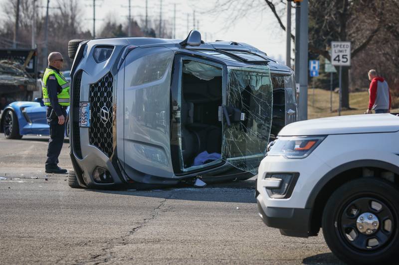 Huntley Fire Protection District firefighters extricated a woman from an SUV after it flipped onto its side in a two-vehicle crash at the intersection of Algonquin and Lakewood roads on Monday afternoon.
