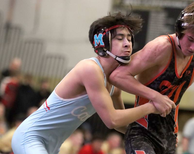 Marian’ Central's Austin Hagevold, left, battles Washington’s Cayden Park at 144 pounds in varsity boys wrestling on Thursday, Feb. 5, 2026, at Sycamore High School in Sycamore. Diego Martinez battles Washington’s Sage Davis at 113 pounds in varsity boys wrestling on Thursday, Feb. 5, 2026, at Sycamore High School in Sycamore.