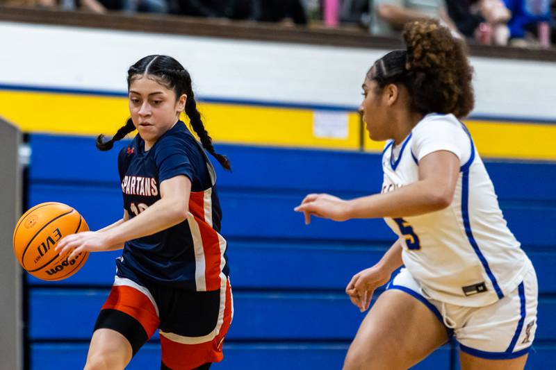 Romeoville's Alexia Hernandez' Ortiz dribbles towards the basket during a varsity girls basketball game against Joliet Central at Joliet Central on Dec. 18, 2025.