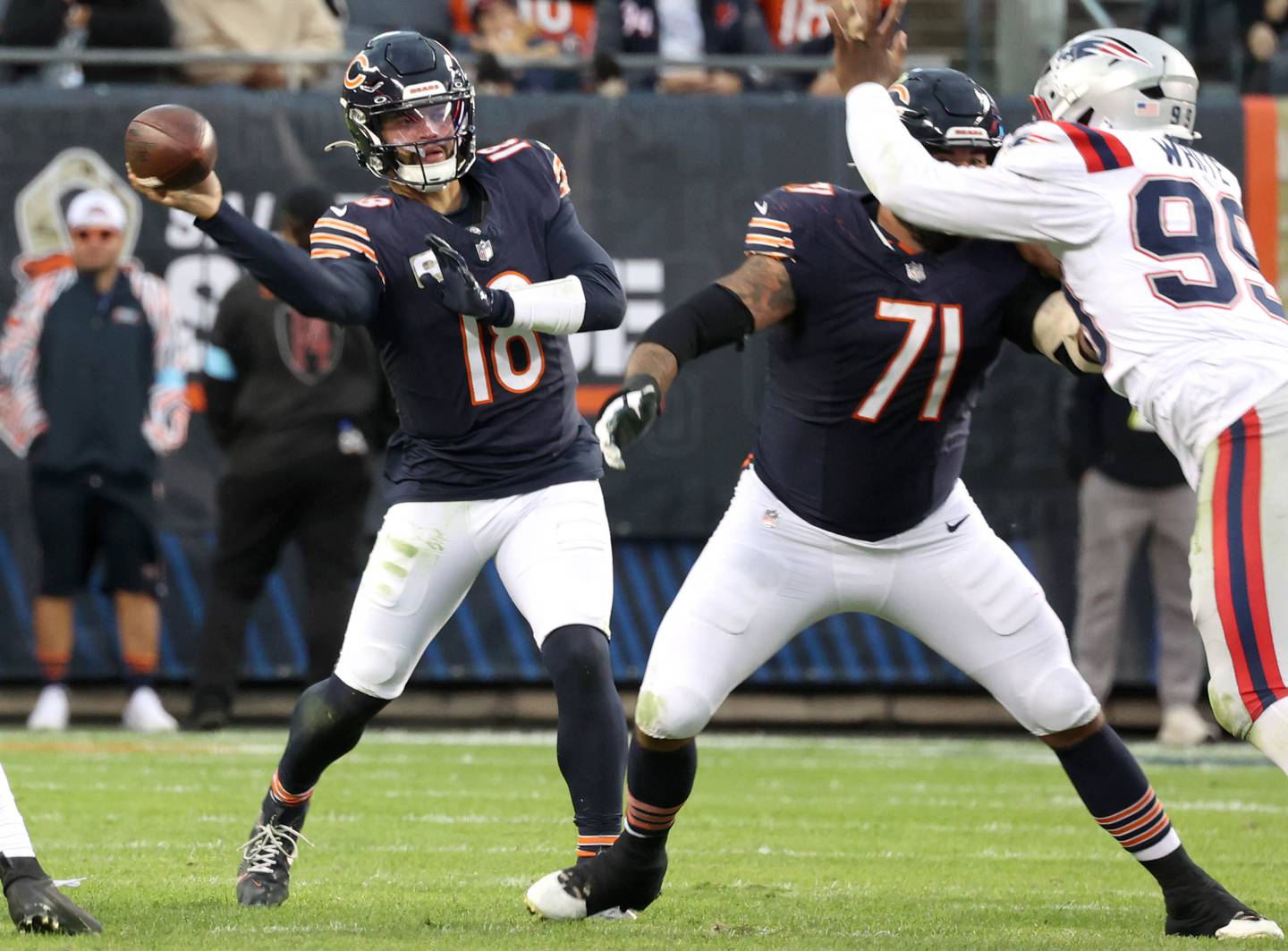 Chicago Bears quarterback Caleb Williams sidearms a pass through the Patriots defensive line during their game Sunday, Nov. 10, 2024, at Soldier Field in Chicago.