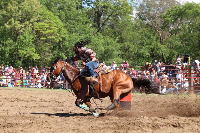 Tremont Moore, of Chicago, makes the turn around a barrel during the 50th Pembroke Rodeo on Sunday, May 24, 2026.